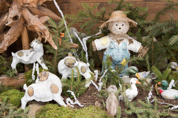 Scarecrow with goats and ducks