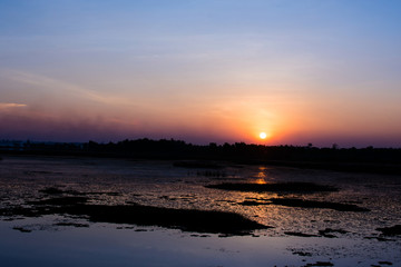 Silhouette swamp with sunset of day.