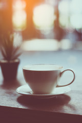 coffee with plant on the wood table