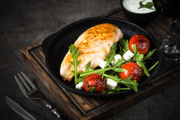 Grilled chiken fillet and fresh vegetables salad.