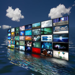 Multiple screens reflected in water  Some elements provided courtesy of NASA
