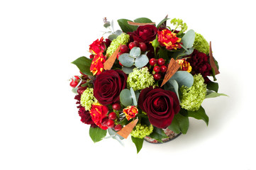 Fototapeta na wymiar red roses and an assortment of flowers in a pot. Valentine's Day