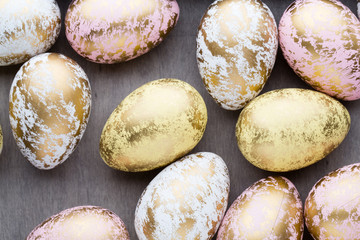 Easter eggs painted in colors on a pattern background.