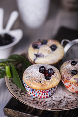 Blueberry muffins with powdered sugar