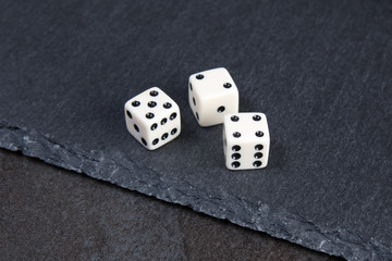 white dice on dark background
