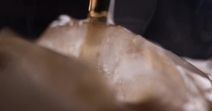 Cola soda in ice slowmotion