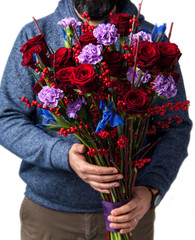 man holds bouquet of red roses. Valentine's Day
