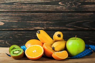 Ripe fresh fruits on wood desk.