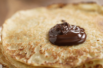 premium dark chocolate pour on freshly made blinis or crepes, simple sweet food