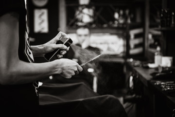 the Barber with the razor at work