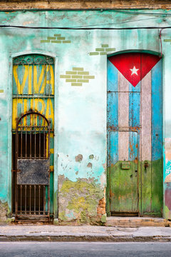 Old  house in Havana with a painted cuban flag