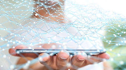 Businessman holding flying network dot over phone 3D rendering