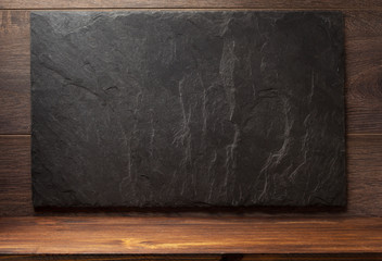 black slate stone on wood