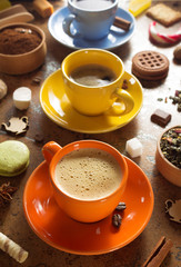 cup of coffee, tea and cacao at table