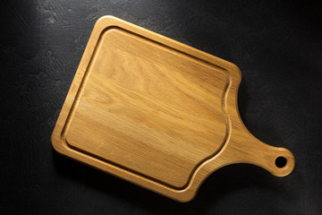 cutting board at black table