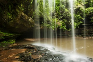 The back side of Caney Creek Falls in the Bankhead National Forest. The falls are located near Double Springs, Alabama. - obrazy, fototapety, plakaty