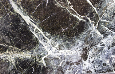 Fototapeta na wymiar Black stone background with cracks, black marble