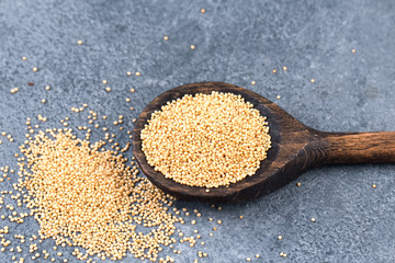 collection of grains in wooden spoon