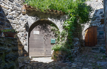 Entrance to the house on a stone street  in the picturesque village of Mirabel.in the Ardeche department in France.