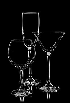 beautiful composition of silhouette empty wine glasses isolated
