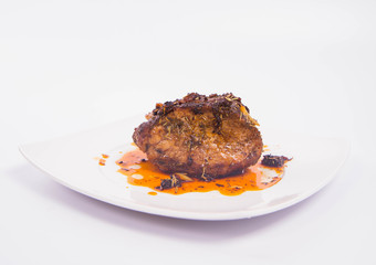 Roast pork on a white plate