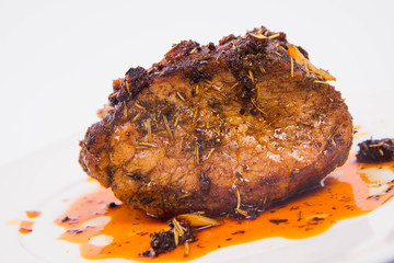 Roast pork on a white plate