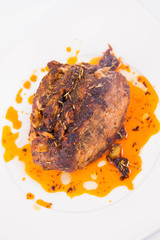 Roast pork on a white plate