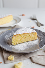 Cake with icing sugar on white background