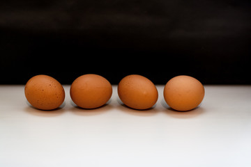 Chicken eggs on rustic black-and-white background