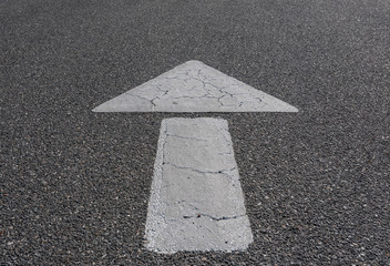 Large White Arrow on Asphalt