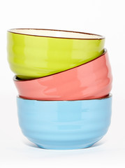 set of colorful ceramic bowls isolated on white background
