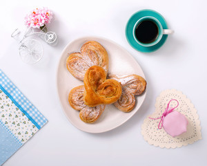 Cinnamon rolls, jam and coffee. Top view.
