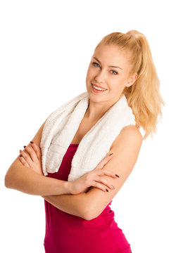 Woman resting after fitness workout with towel arounfd her neck