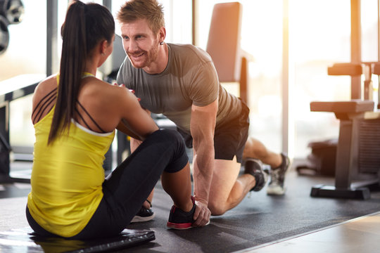 Man And Woman Looking At Each Other In Gym