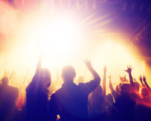 Fototapeta premium a crowd of people at a concert with a slight blur toned with a retro vintage filter