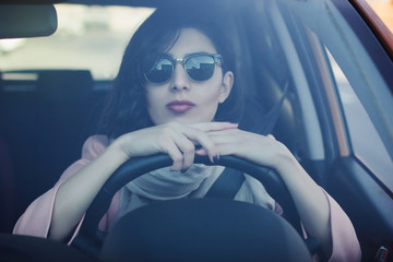 Young woman driving her car