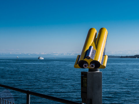 Yellow Binoculars at a Lake