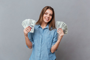 Woman in shirt with money in hands