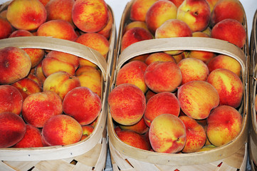 fresh peach in basket for sale
