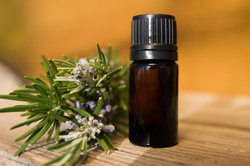 Rosemary oil in small glass bottle
