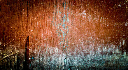 Bright brown background with dark corners. The texture of the old painted plywoo