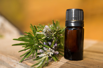 Rosemary oil in small glass bottle
