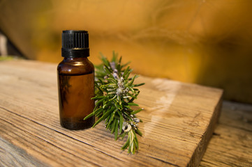 Rosemary oil in small glass bottle