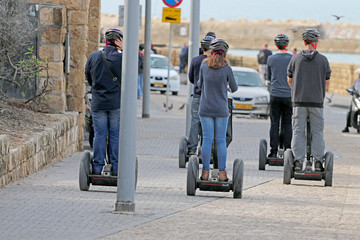 people go on an electrical wheels, transportation to skiing