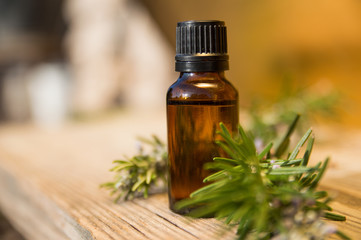 Rosemary oil in small glass bottle