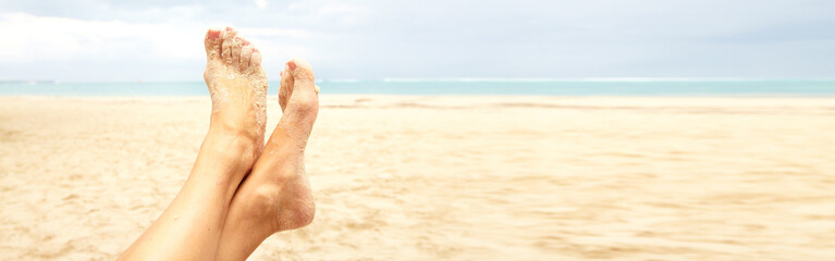 Woman legs on the beach