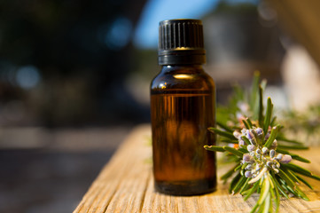 Rosemary oil in small glass bottle