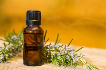 Rosemary oil in small glass bottle