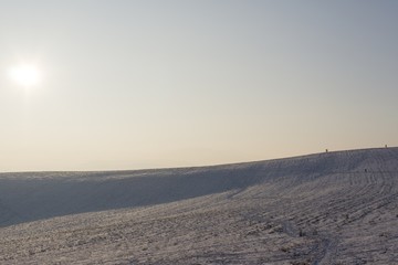 Sunset on meadow with snow during winter. Slovakia
