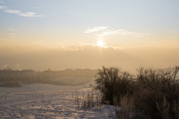 Sunrise on meadow covered by snow during winter. Slovakia